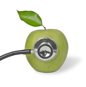 Green apple with stethoscope